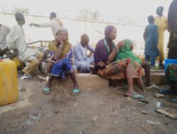 Before Dawn, They Queue for Water .